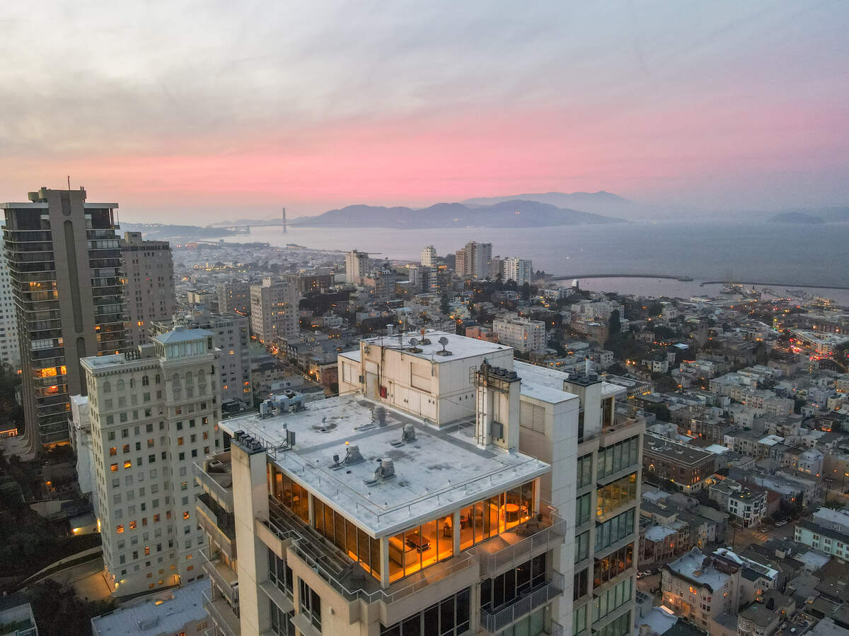 The home occupies the entire top floor of the high-rise, where more than 2,000 square feet of terraces encircle the residence.